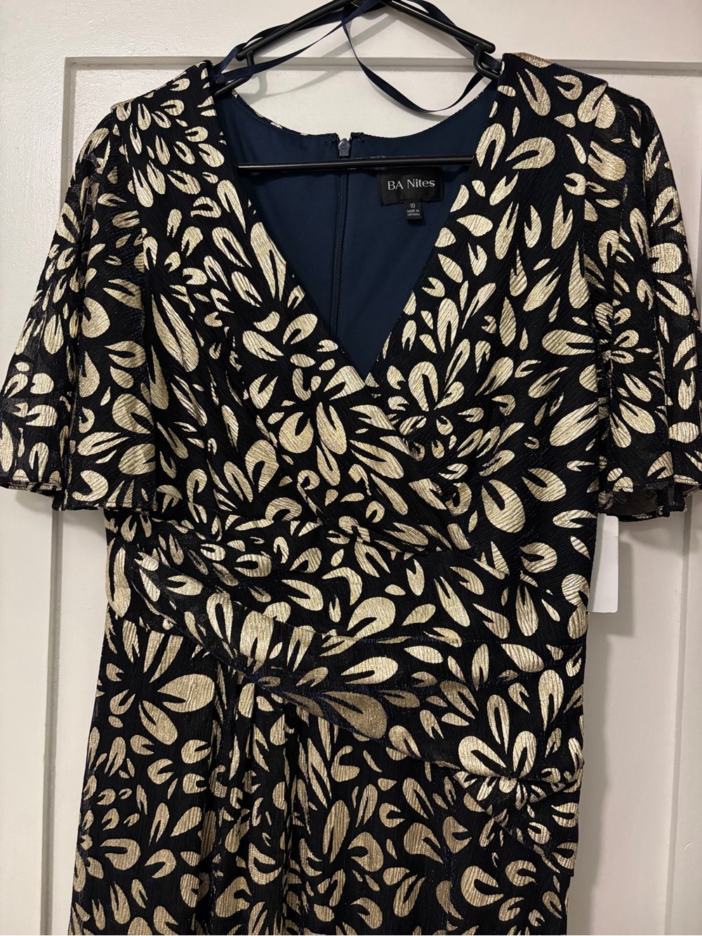 Black and Gold long dress with side split, very beautiful. It is a navy blue.